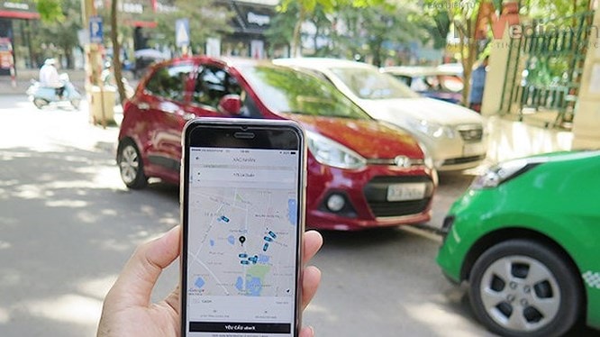 Các hãng taxi truyền thống cho rằng Uber, Grab đang cạnh tranh thiếu lành mạnh, phá giá thị trường. Ảnh: Bộ Công thương