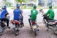 Bản chất của thương vụ Grab mua Uber