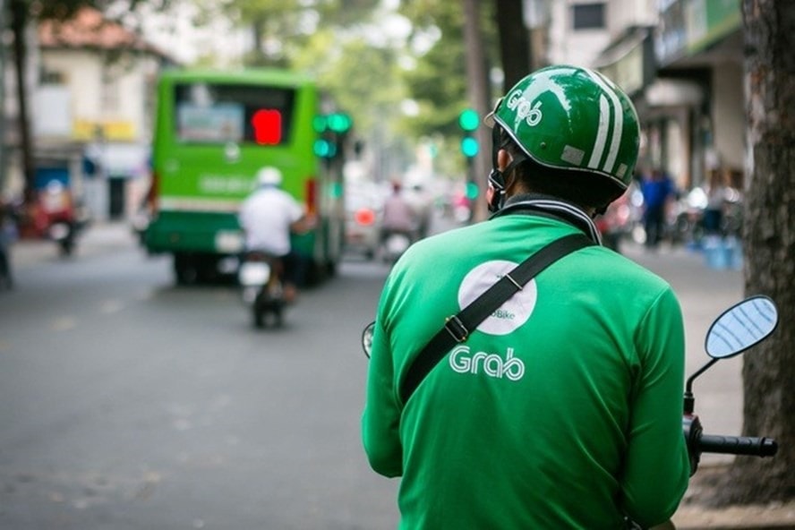 Việc sáp nhập giữa Grab và Gojek nếu xảy ra sẽ tác động rất lớn tới thị trường gọi xe. Ảnh: Trọng Đạt