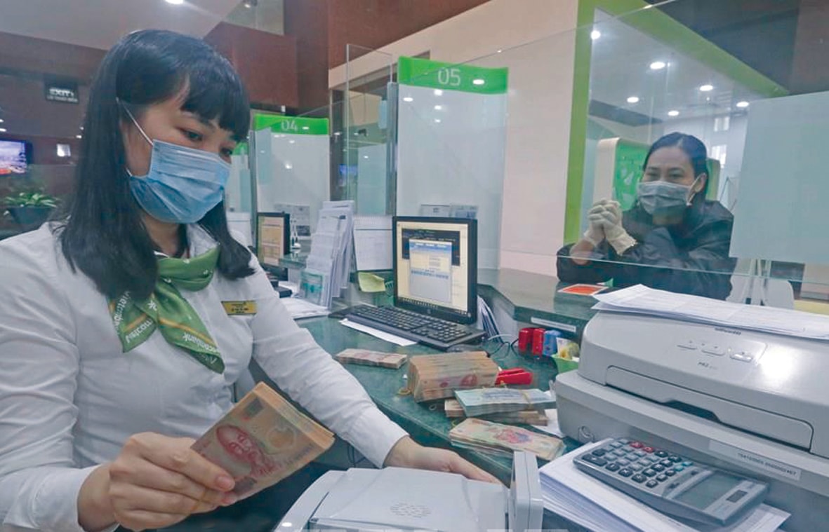  Vietcombank vừa giảm lãi vay 1%/năm cho các doanh nghiệp. Ảnh: T.Việt