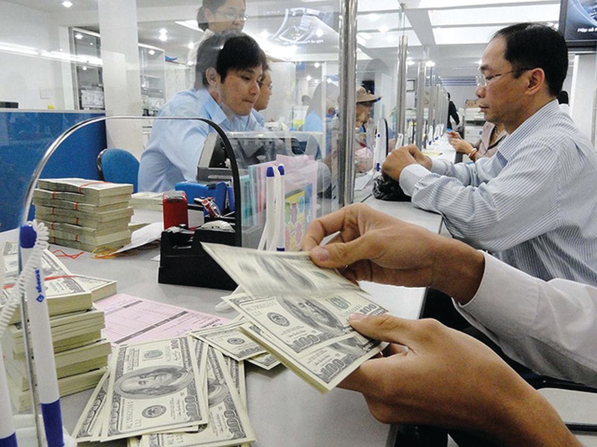  USD tăng đã và đang gây khó khăn cho nhiều doanh nghiệp. Ảnh: T.L