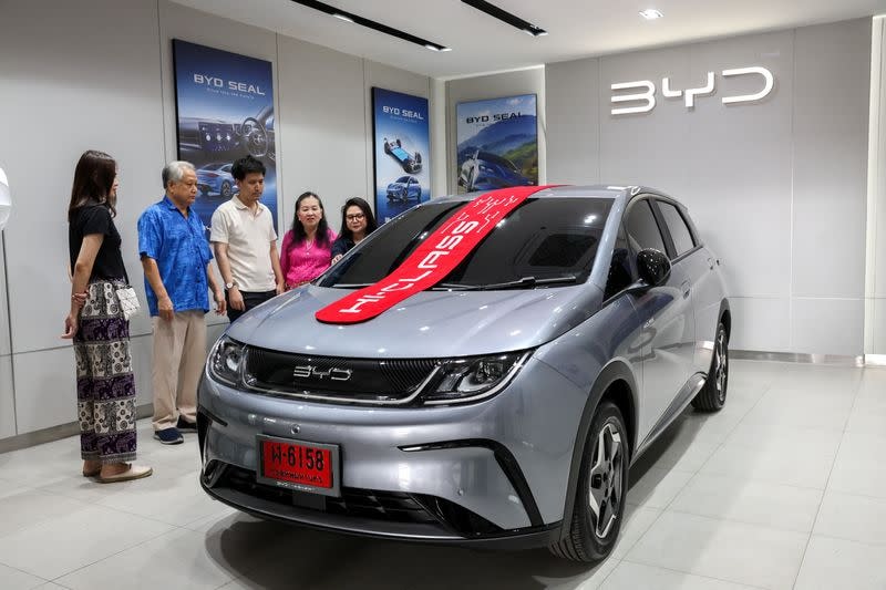 a-thai-family-inspects-a-byd-dolphin-ev-at-a-show-room-in-bangkok-rs.jpeg