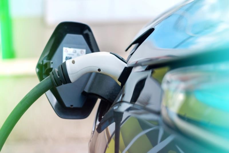 plugged-charger-into-electric-car-charge-station(1).jpg